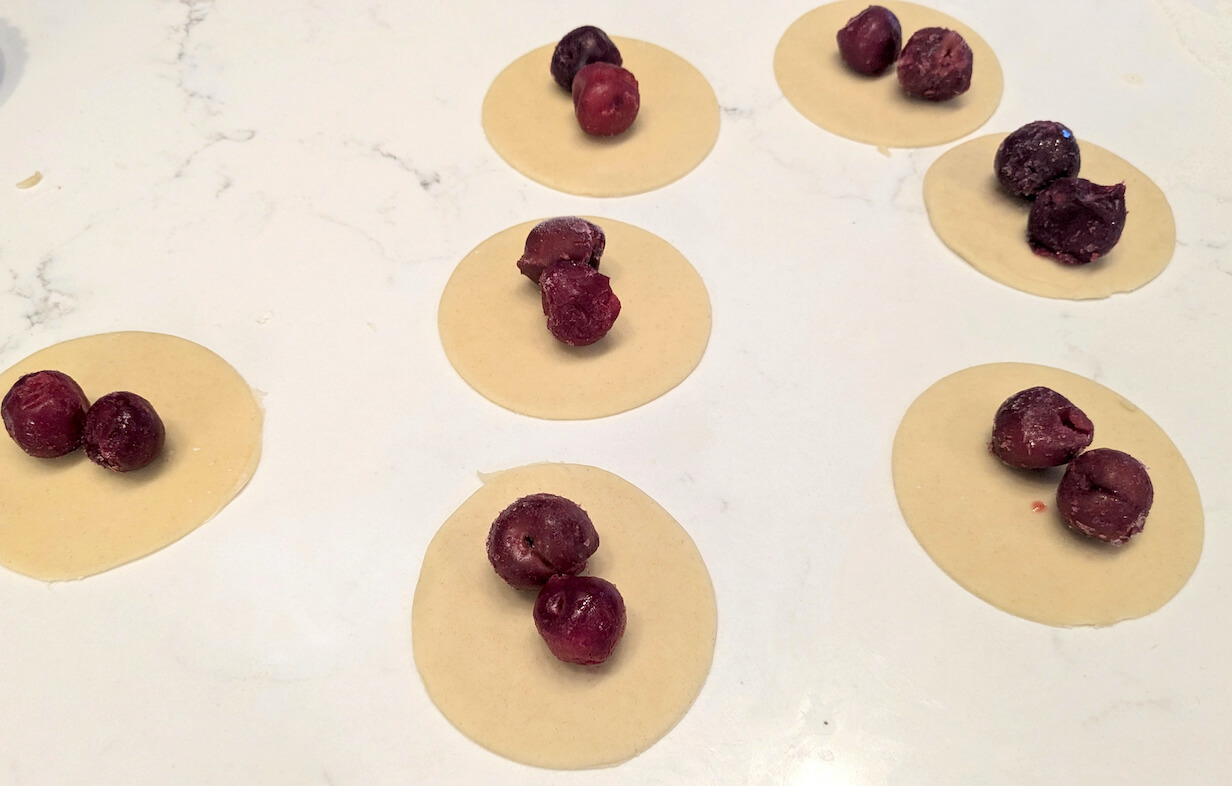 Cherry varenyky, sweet dumplings with a cherry filling.