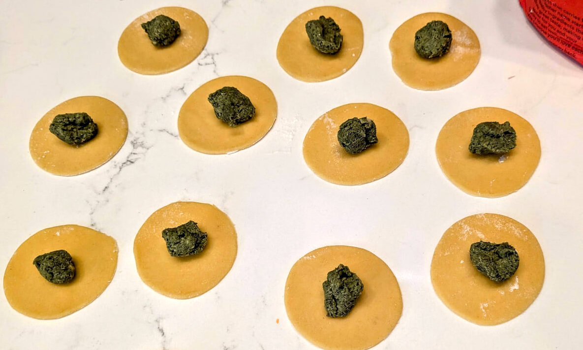 Tortellini with spinach, mushroom, and fontina filling, a traditional Italian pasta.